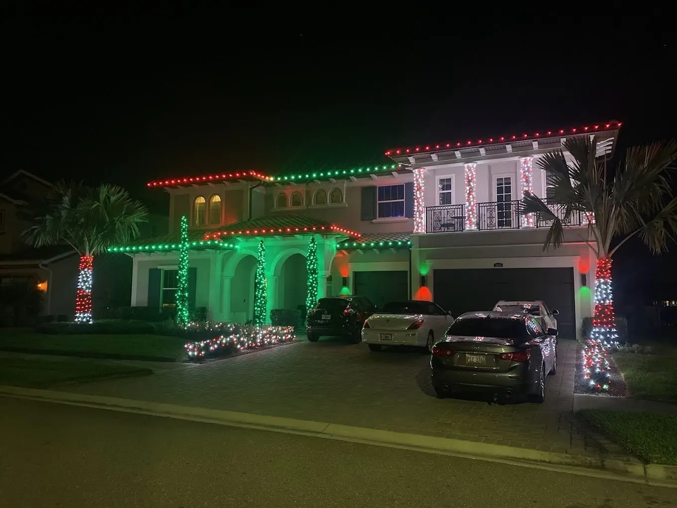 Full Coral Gables home in red and green Christmas lights