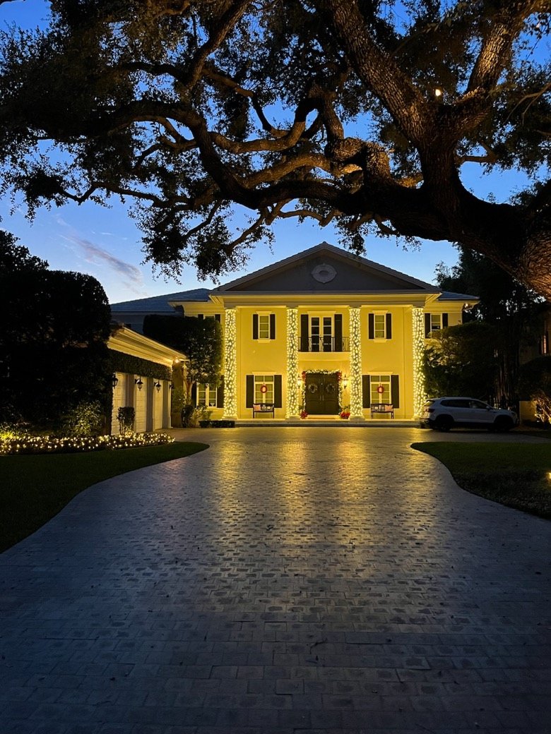 A Coral Gables estate hand-lit by Happy Lights of Miami at twilight